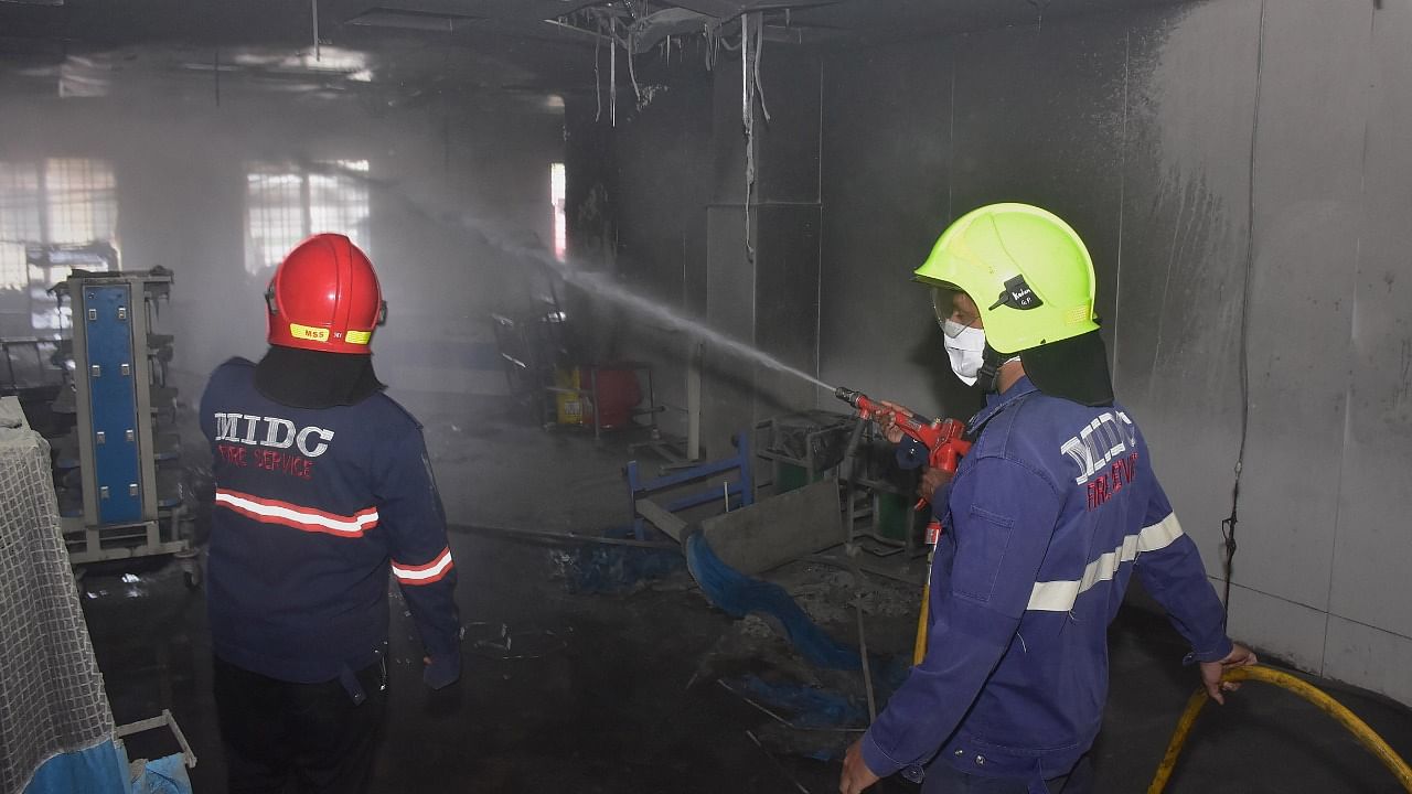 Firefighters attempt to douse the fire after it broke out at the ICU of Civil Hospital in Ahmednagar. Credit: PTI File Photo