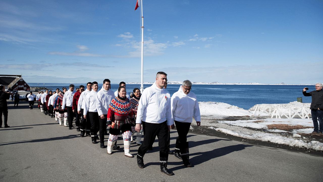 Chairman of the Naalakkersuisut, the Greenlandic Parliament, Kim Kielsen of the party Siumut (front, center), and Hans Enoksen of the party Partii Naleraq (front, right), followed by the rest of the newly elected parliamentarians. Credit: Reuters Photo