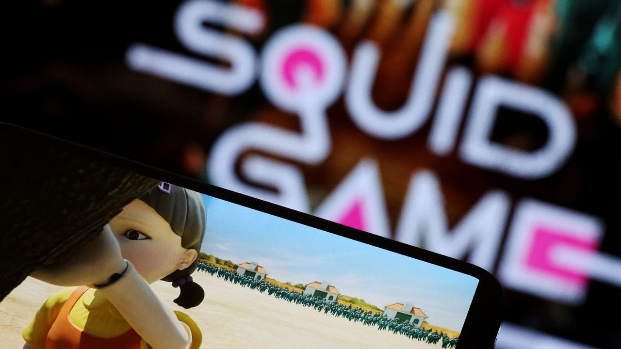  The Netflix series "Squid Game" is played on a mobile phone in this picture illustration. Credit: Reuters File Photo