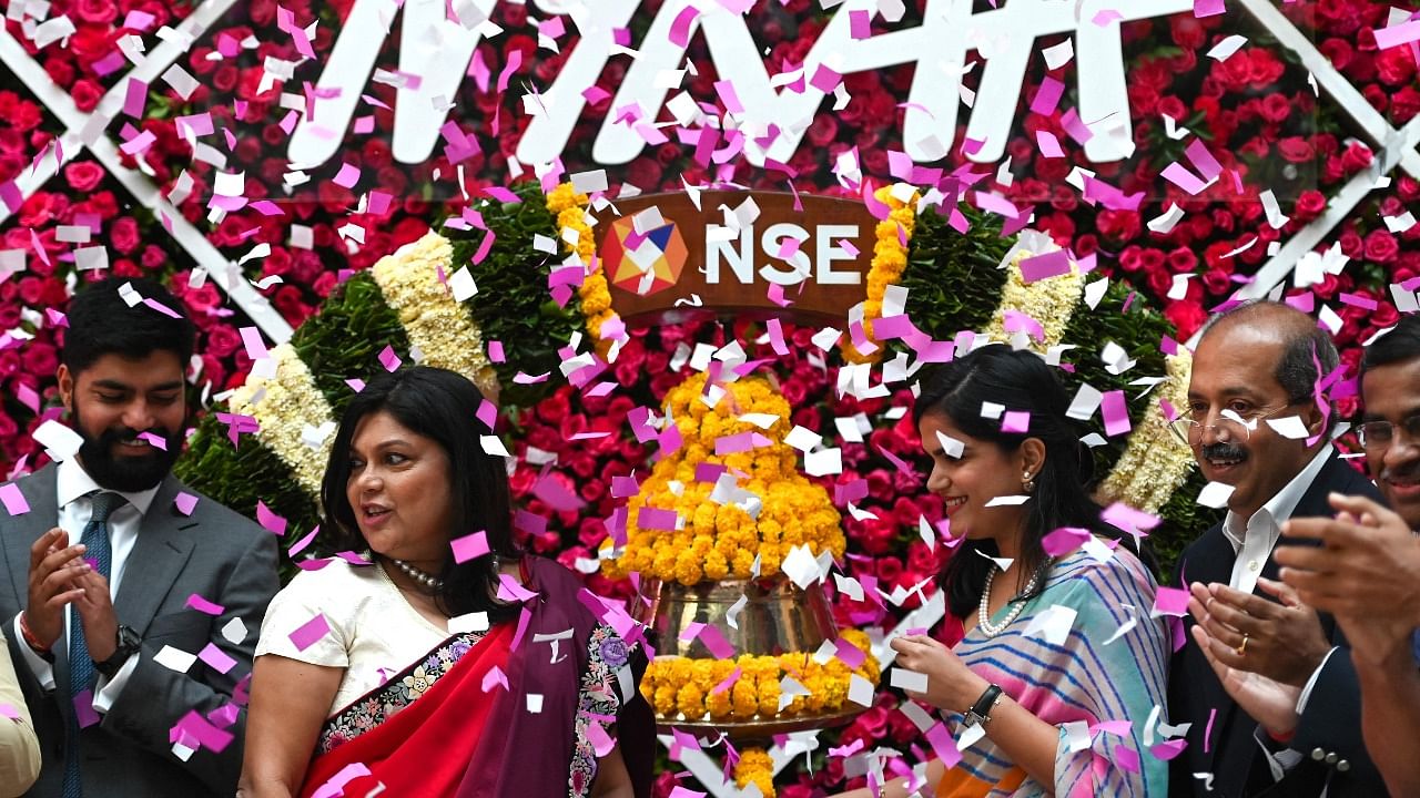 Falguni Nayar (2nd from left), MD and CEO of Nykaa during the company's IPO listing ceremony at the National Stock Exchange in Mumbai. Credit: AFP Photo
