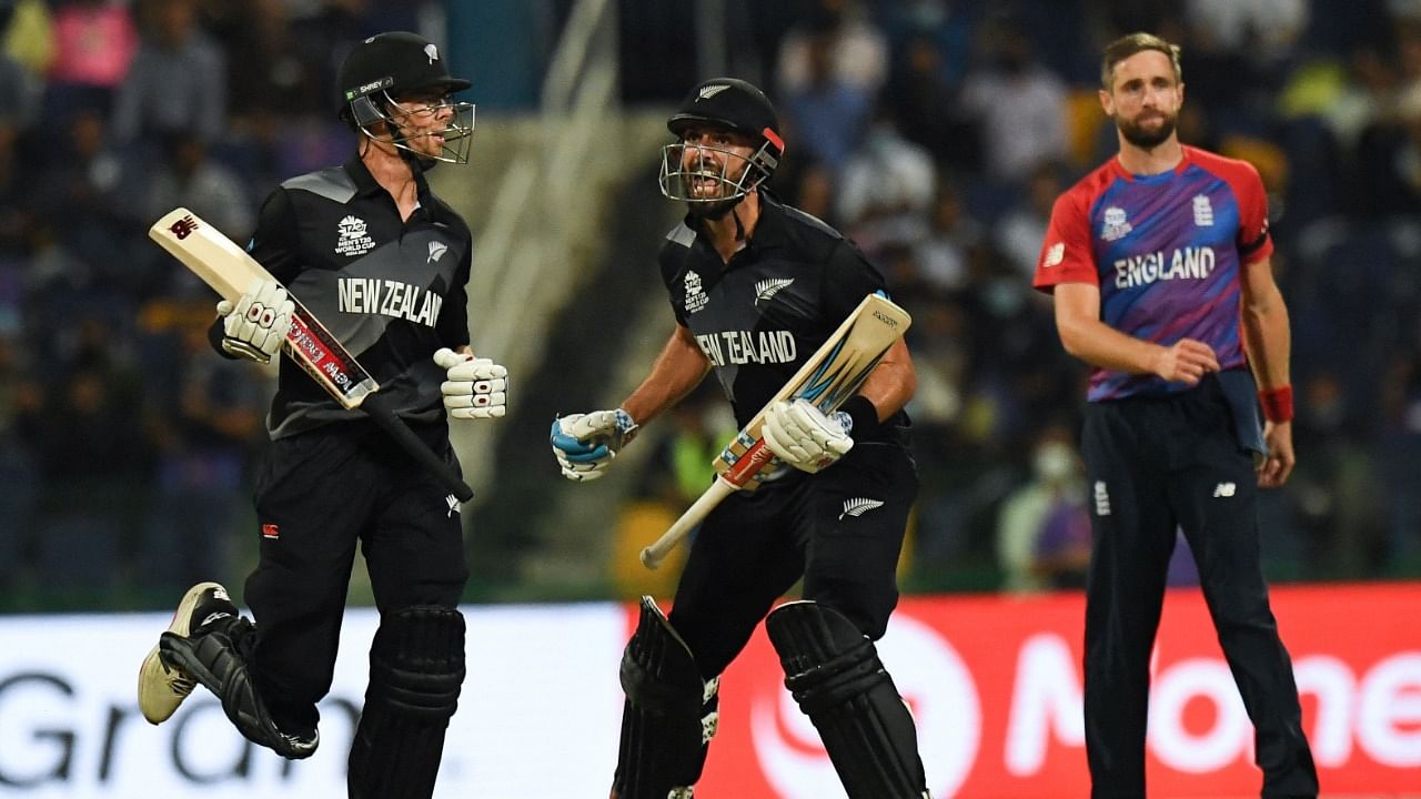 New Zealand's Daryl Mitchell (C) reacts after defeating England in the semi-final of the ICC T20 World Cup in Abu Dhabi. Credit: AFP Photo