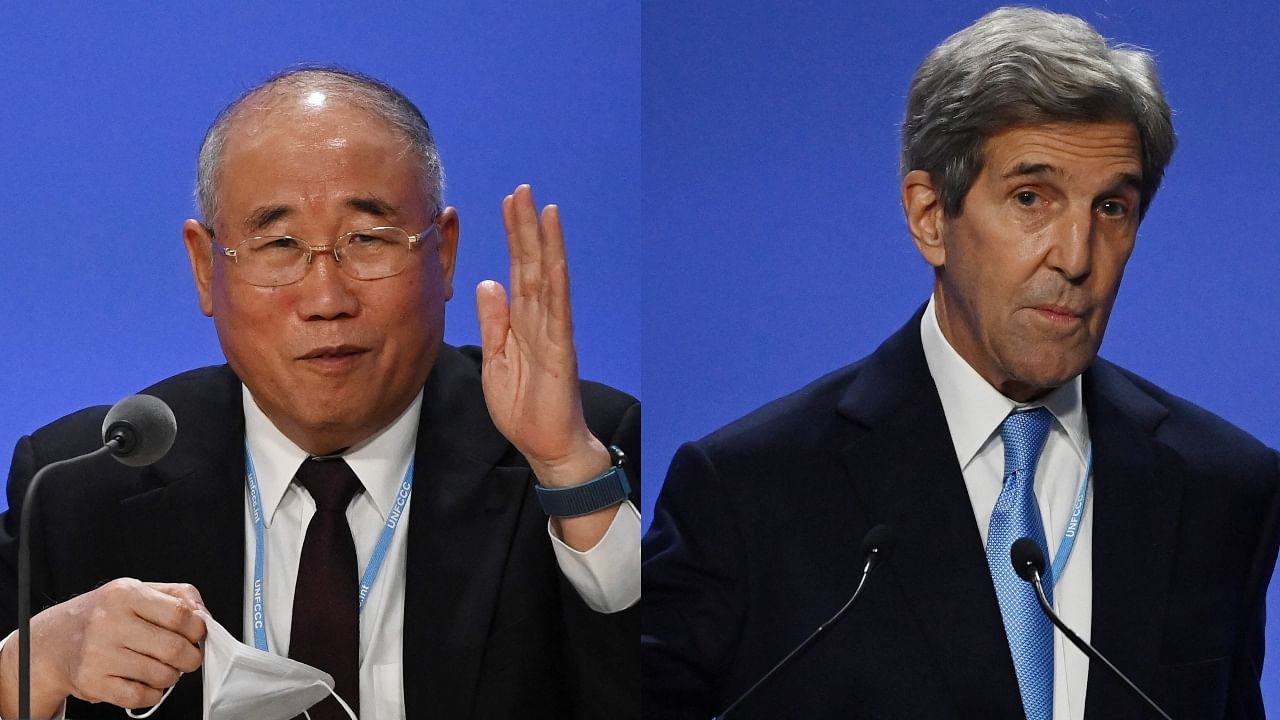 Chinese climate envoy Xie Zhenhua (L) and his US counterpart John Kerry at the COP26 summit in Glasgow. Credit: AFP Photos
