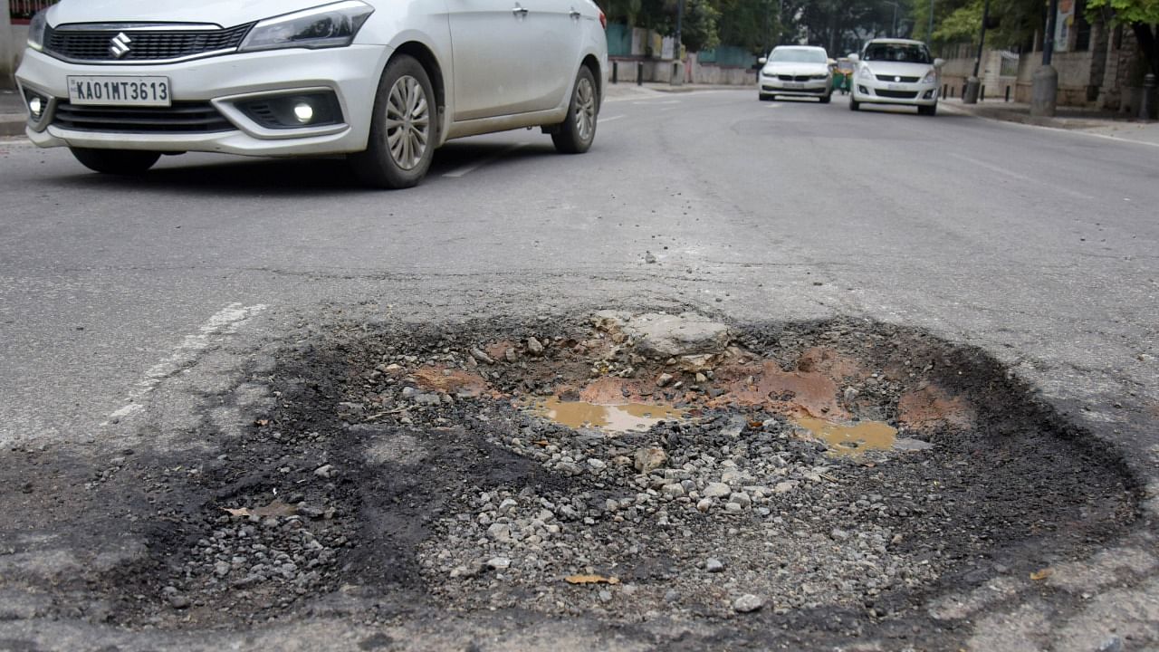 A pothole seen on the TenderSURE Museum Road in Bengaluru. Credit: DH File Photo/Pushkar V