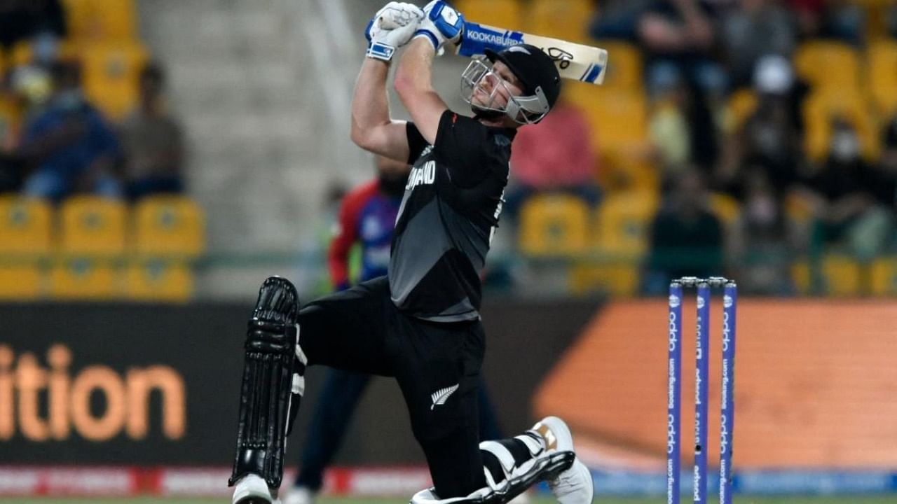 New Zealand's James Neesham hits a six during the ICC men’s Twenty20 World Cup semi-final match between England and New Zealand at the Sheikh Zayed Cricket Stadium in Abu Dhabi. Credit: AFP Photo