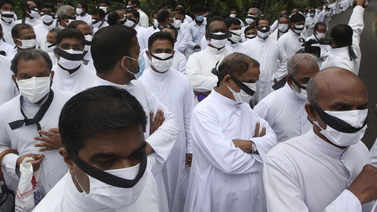 <div class="paragraphs"><p>Priests stage protest against the move to impose uniform code for service at churches under Syro Malabar Church, in Kerala. </p></div>