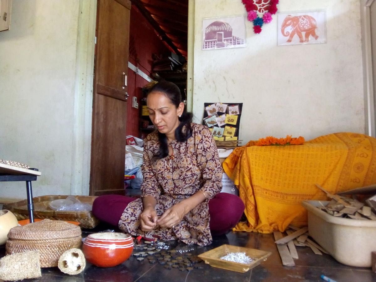 Farmer entrepreneur Kusuma from Devimane in Uttara Kannada district at work, making natural crafts