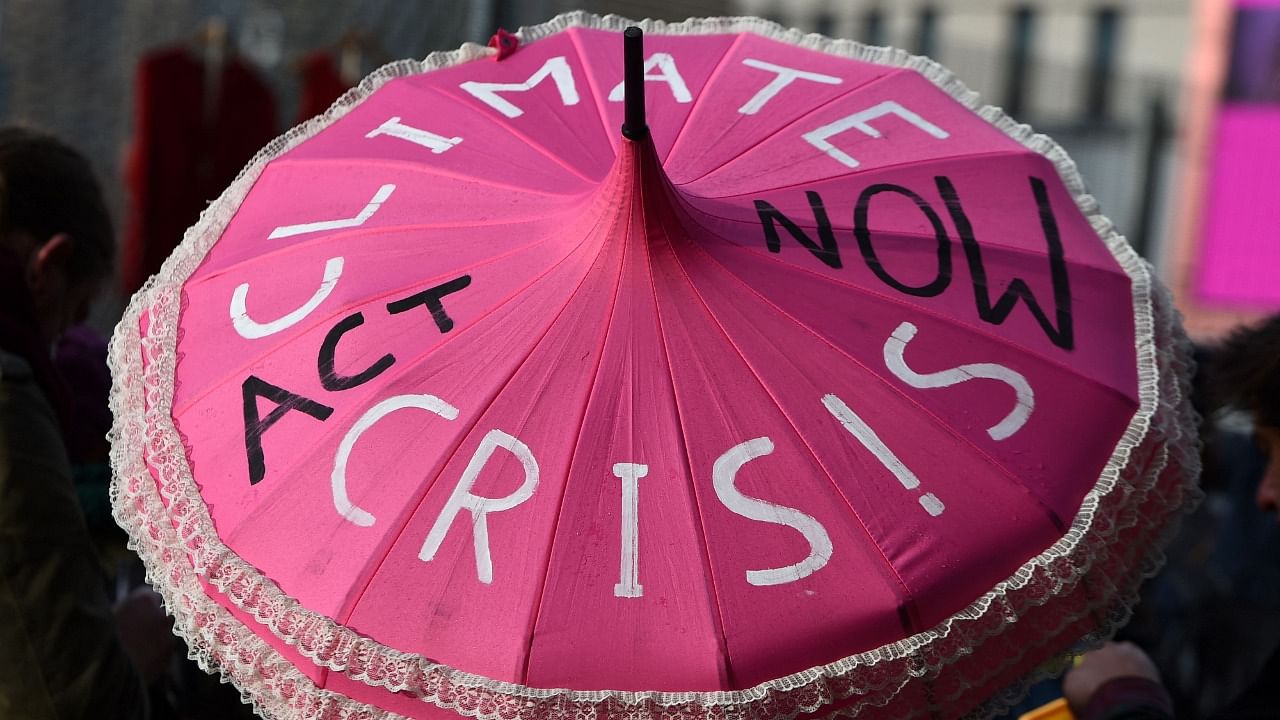 Climate activists demonstrate outside of the COP26 Climate Change Conference in Glasgow. Credit: AFP File Photo