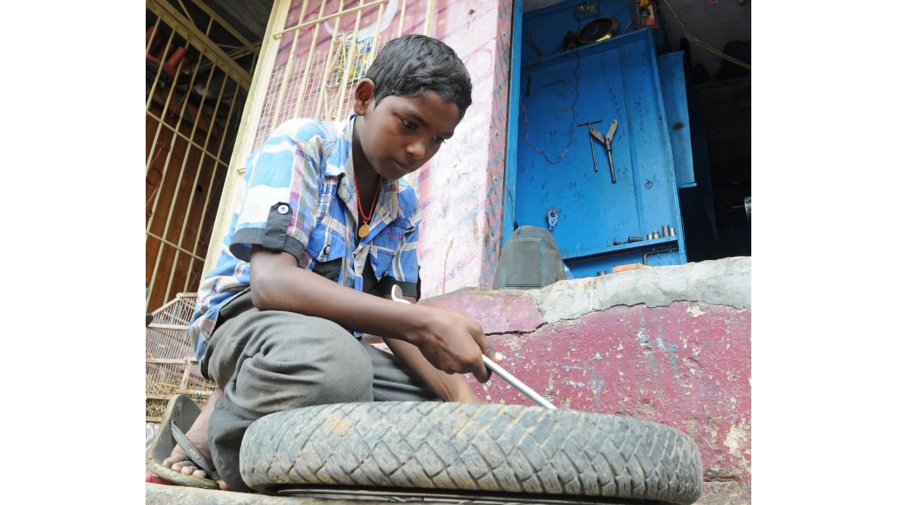 Apart from agriculture, cases of disguised child labour is high when it comes to street vendors like chat shops, vegetable and fruit carts and flower sellers. Credit: DH Photo