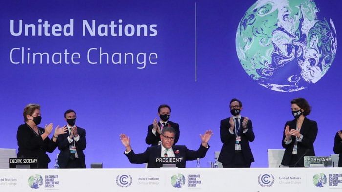 OP26 President Alok Sharma gestures as he receives applause during the UN Climate Change Conference (COP26) in Glasgow. Credit: Reuters photo