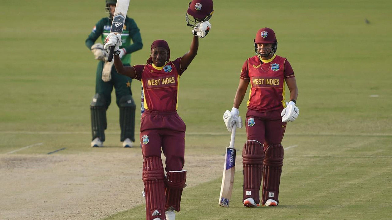 West Indies's Stafanie Taylor (C) celebrates after scoring a century 100 runs during the third and last one day international (ODI) women's cricket match between Pakistan and West Indies. Credit: AFP Photo
