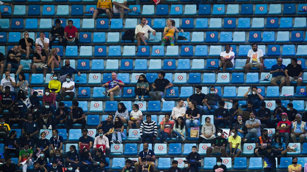 Spectators watch the ICC men’s Twenty20 World Cup final match between Australia and New Zealand at the Dubai International Cricket Stadium in Dubai. Credit: AFP Photo