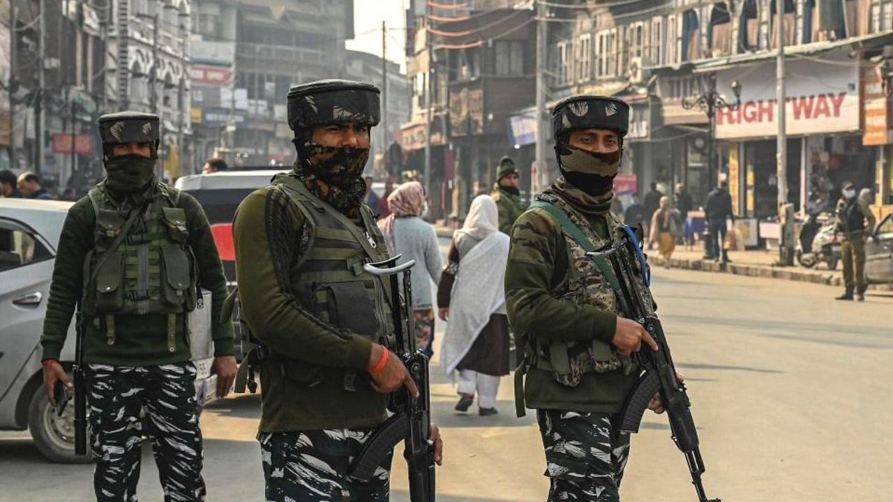 Paramilitary troopers stand guard during a random search along a street in Srinagar on November 9, 2021, a day after a salesman was shot dead by suspected anti-India militants. Credit: AFP Photo