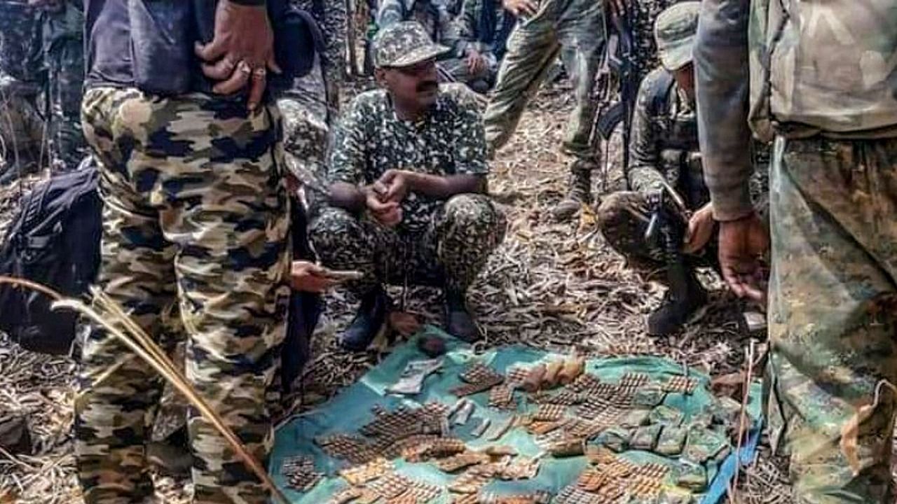 Police personnel show cartridges recovered from five Naxals who were killed after an encounter with C60 commandos in Khobra Mendha forest in Gadchiroli district of Maharashtra on March 29, 2021. Credit: PTI File Photo
