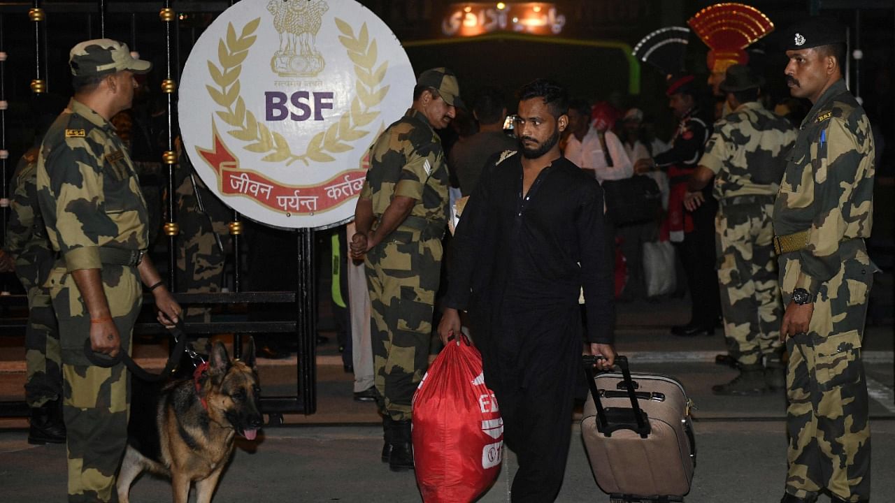 Released Indian fishermen cross over the India-Pakistan Wagah border post. Credit: iStock Photo