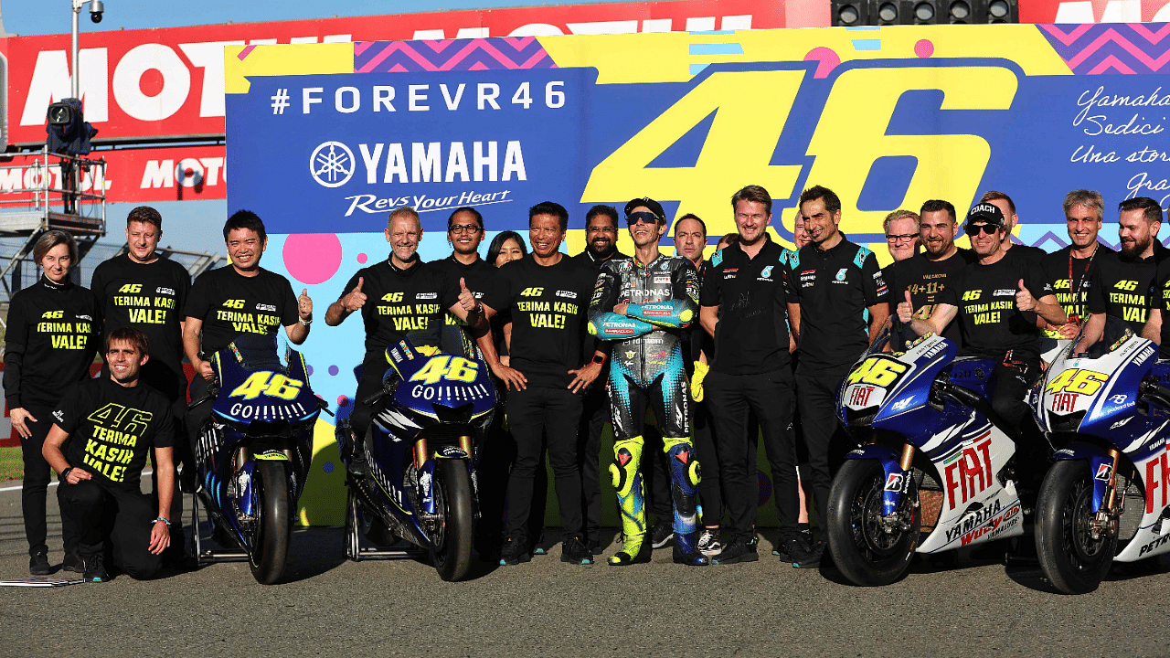 Valentino Rossi (centre) with his SRT Yamaha teammates. Credit: AFP Photo