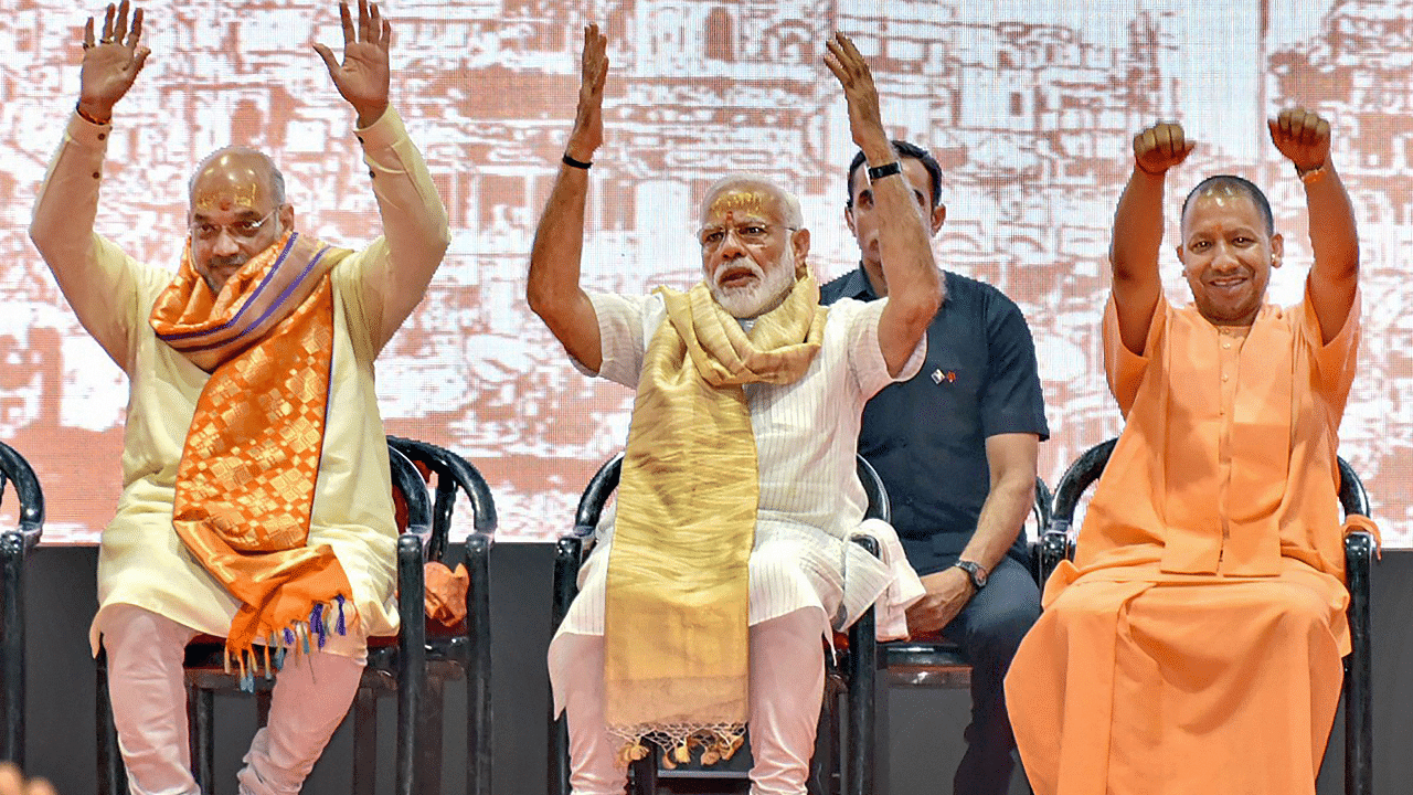 Prime Minister Narendra Modi with BJP President Amit Shah and UP CM Yogi Adityanath. Credit: PTI Photo