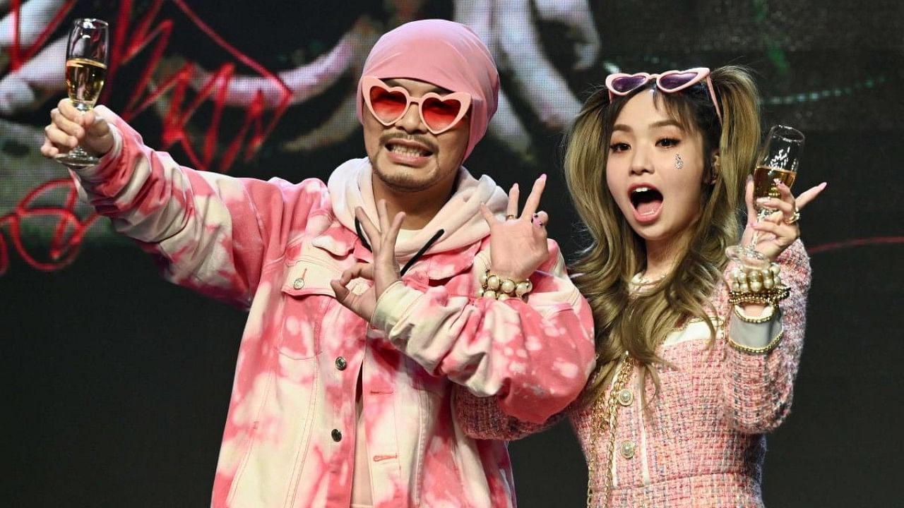 Malaysian rapper Wee Meng Chee (L), known by his stage name Namewee, and Taiwan-based Australian singer Kimberley Chen. Credit: AFP Photo