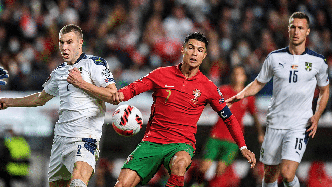 Serbia's defender Strahinja Pavlovic (L) fights for the ball with Portugal's forward Cristiano Ronaldo during the FIFA World Cup Qatar 2022. Credit: AFP Photo