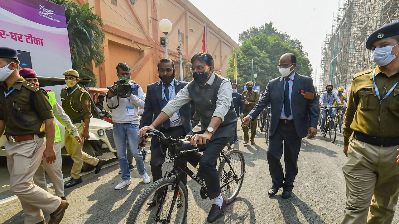 Union Health Minister Mansukh Mandaviya arrives on a cycle to inaugurate the Health Pavilion at India International Trade Fair 2021. Credit: PTI Photo