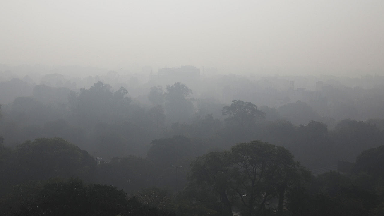 Buildings are seen shrouded in smog in New Delhi. Credit: Reuters photo