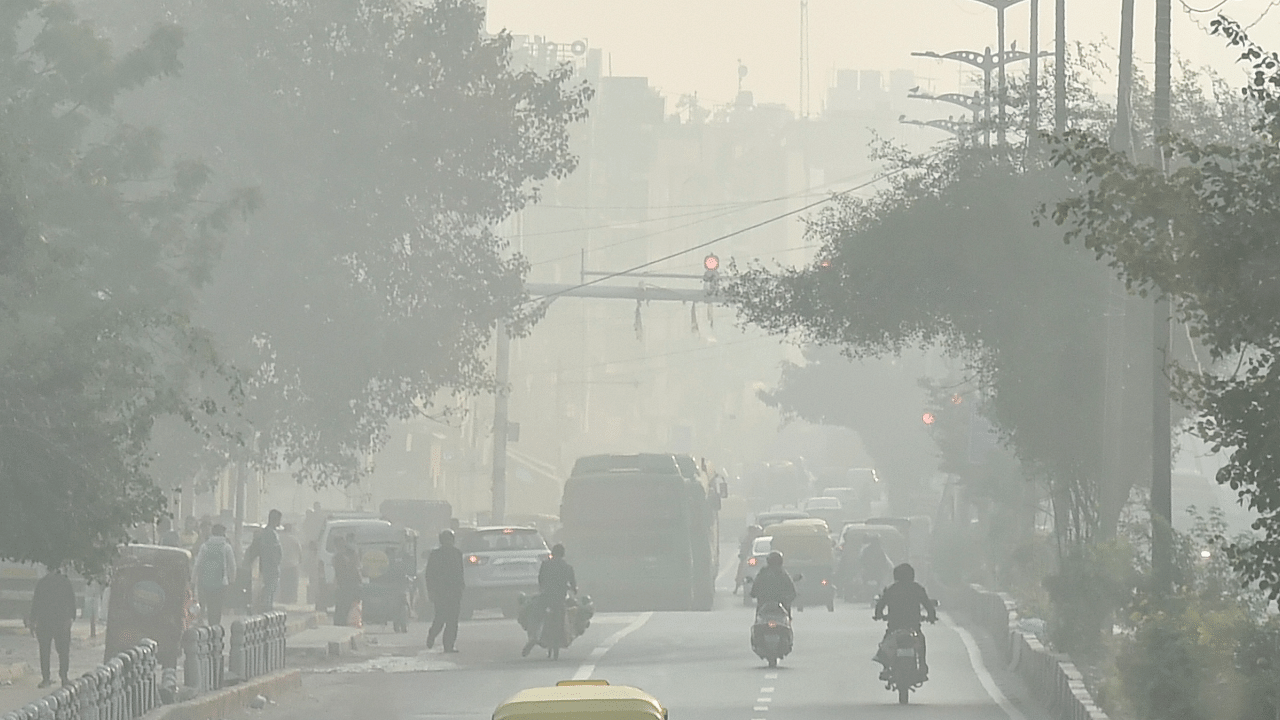 Vehicles ply on a road amid smog, in New Delhi. Credit: PTI Photo