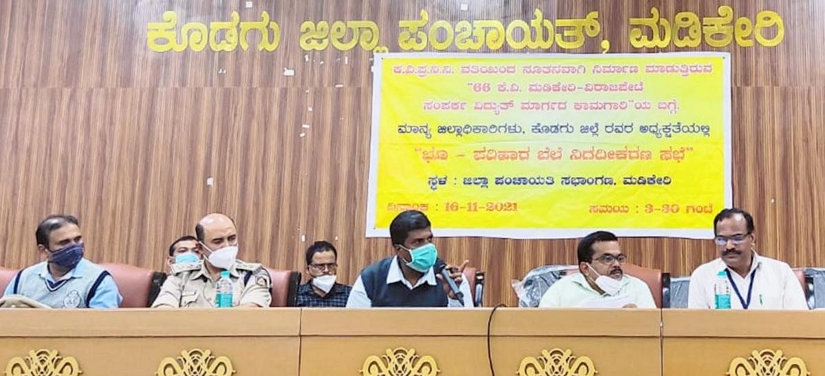 Officials conduct a meeting on the new 66 kv power line, in Madikeri, on Wednesday. DH Photo