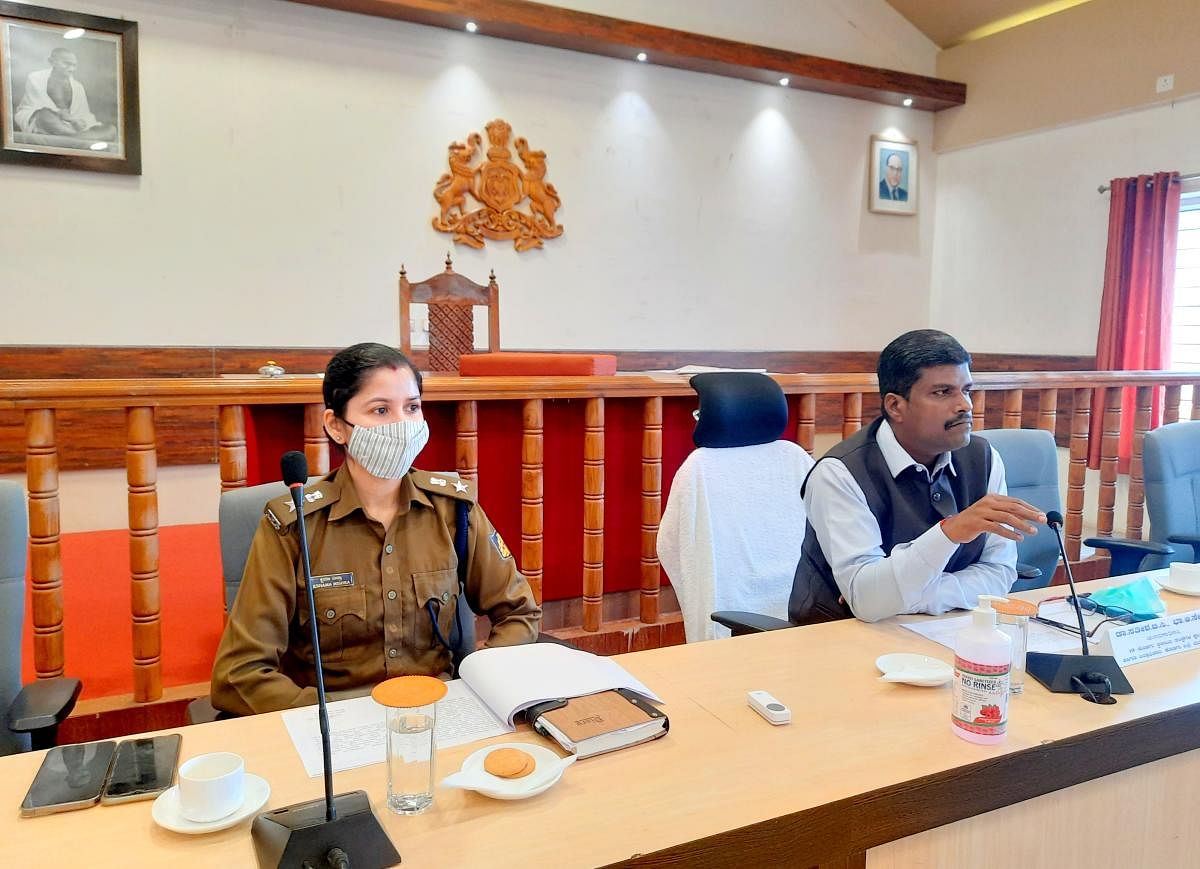 Deputy Commissioner Dr B C Sateesha chairs the district vigilance and monitoring committee meeting at his office on Wednesday. DH Photo