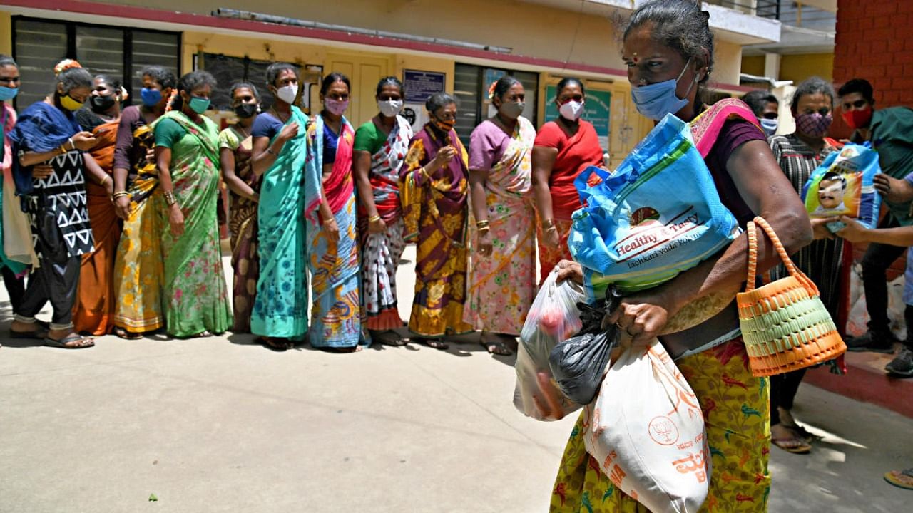 Transgenders depend on government help because they do not have many livelihood options. The photo shows transgenders queuing up to receive groceries during the lockdown in May 2021. Credit: DH File Photo/Pushkar V