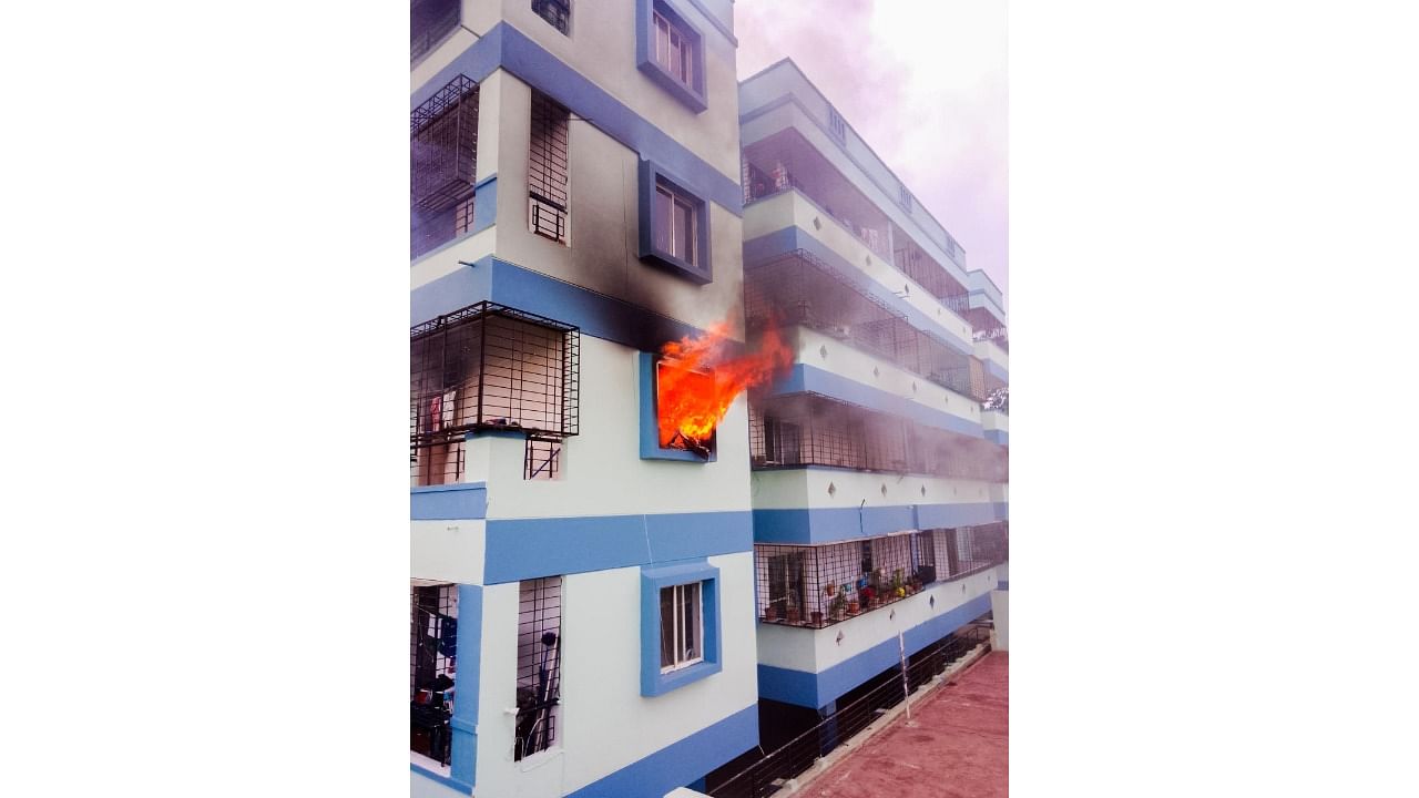 A fire broke out at VMAKS Charlet in Vasundhara Layout in Hebbagodi on Wednesday. Credit: Special Arrangement
