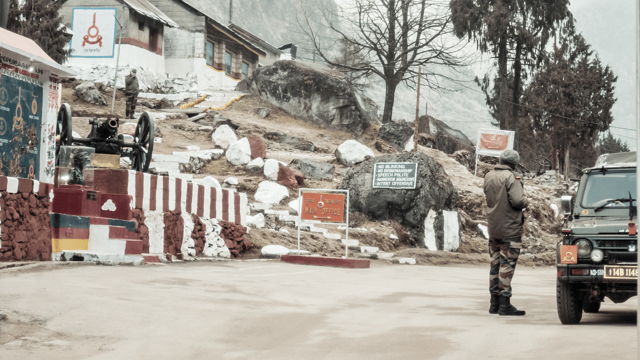 An Indian BSF army major watches Indian post at a 14,500 Ft high mountain pass on "McMahon" line in Indo Nepal and Indo Bhutan border area on way through himalayan roads. Credit: Getty Images