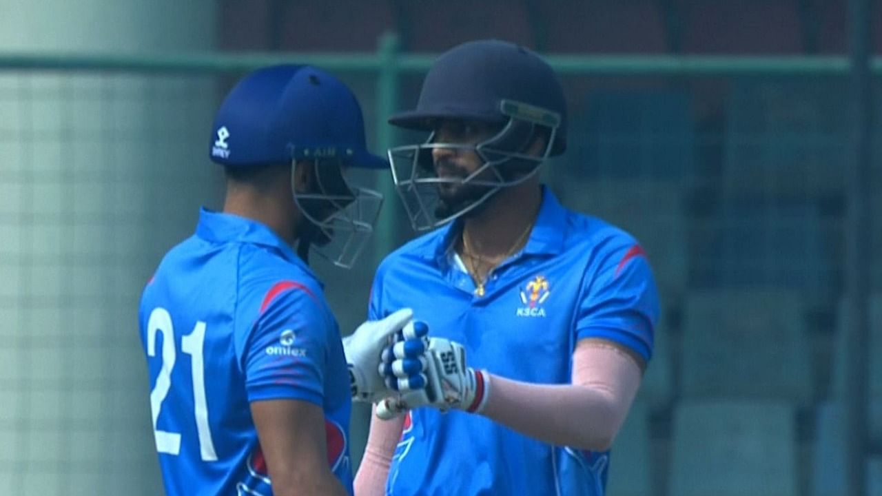 Karnataka's Rohan Kadam (R) celebrates scoring a half century with skipper Mayank Agarwal against Vidarbha during the Syed Mushtaq Ali Trophy T20 semi-final. Credit: Twitter/@BCCIdomestic