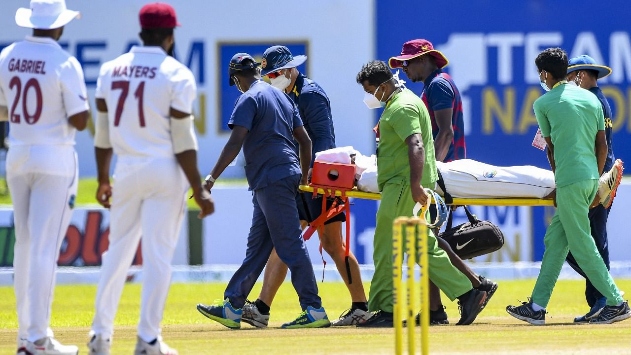 West Indies' Jeremy Solozano is carried on a stretcher after getting injured during the first day of the first Test cricket match against Sri Lanka Stadium in Galle. Credit: AFP Photo