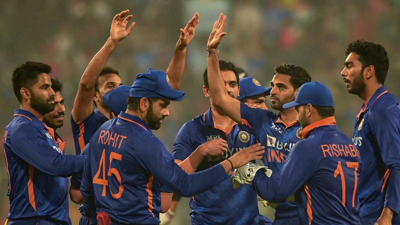 India's cricketers celebrate after the dismissal of New Zealand's James Neesham (not pictured) during the third T20I in Kolkata. Credit: AFP Photo