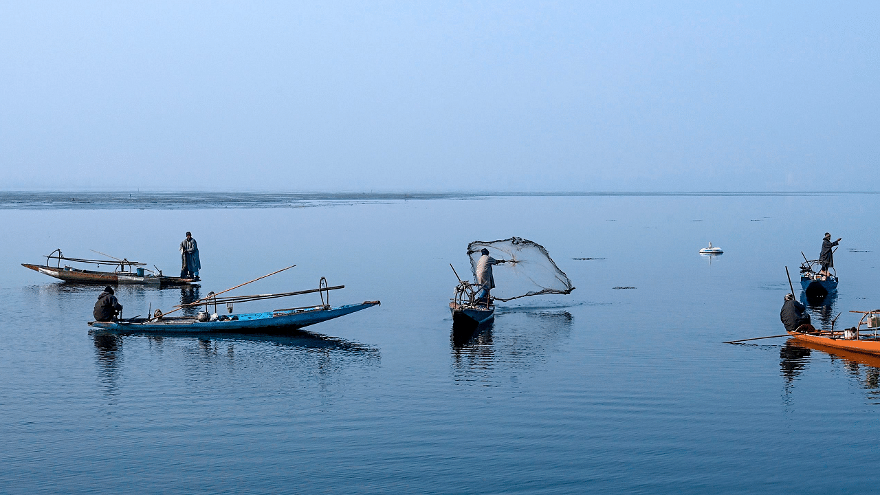 File photo of fishermen at Dal lake in Kashmir. Credit: AFP Photo