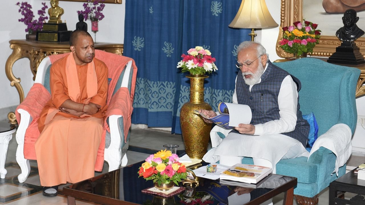 Prime Minister Narendra Modi with Uttar Pradesh CM Yogi Adityanath during a meeting at Raj Bhavan in Lucknow. Credit: PTI File Photo