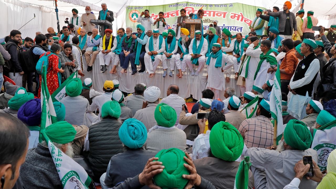 Farmers listen to a speaker as they attend a mass rally to demand minimum support prices be extended to all produce, in Lucknow. Credit: Reuters File Photo
