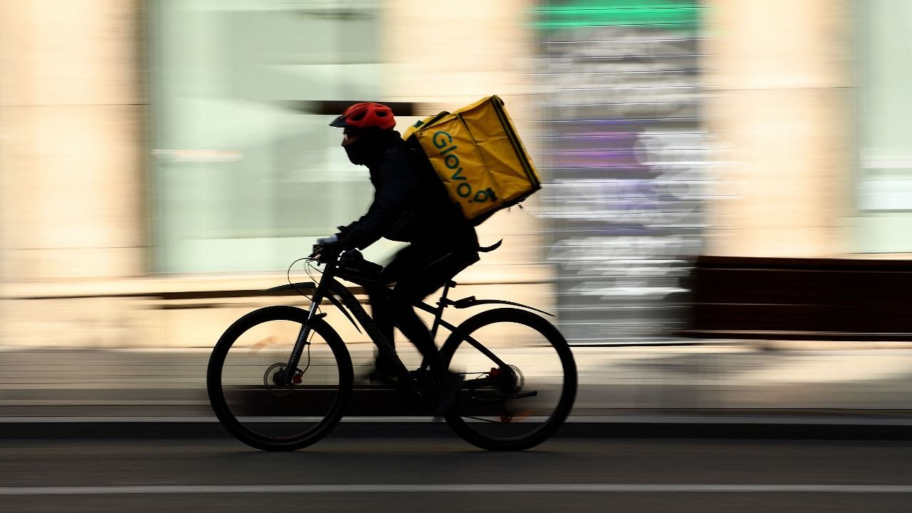 Just weeks after Spain became the first EU member to give delivery workers labour rights, firms that employ them like Uber Eats or Just Eat are still struggling to adapt to a new law which may become a model for the rest of Europe. Credit: AFP File Photo