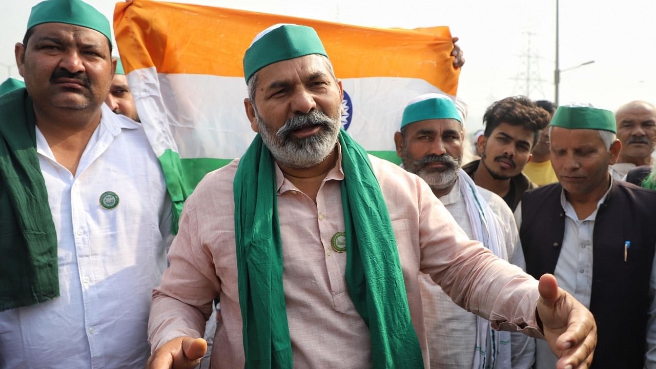 Bharatiya Kisan Union (BKU) leader Rakesh Tikait with farmers after repeal of farm laws at Ghazipur Border. Credit: IANS