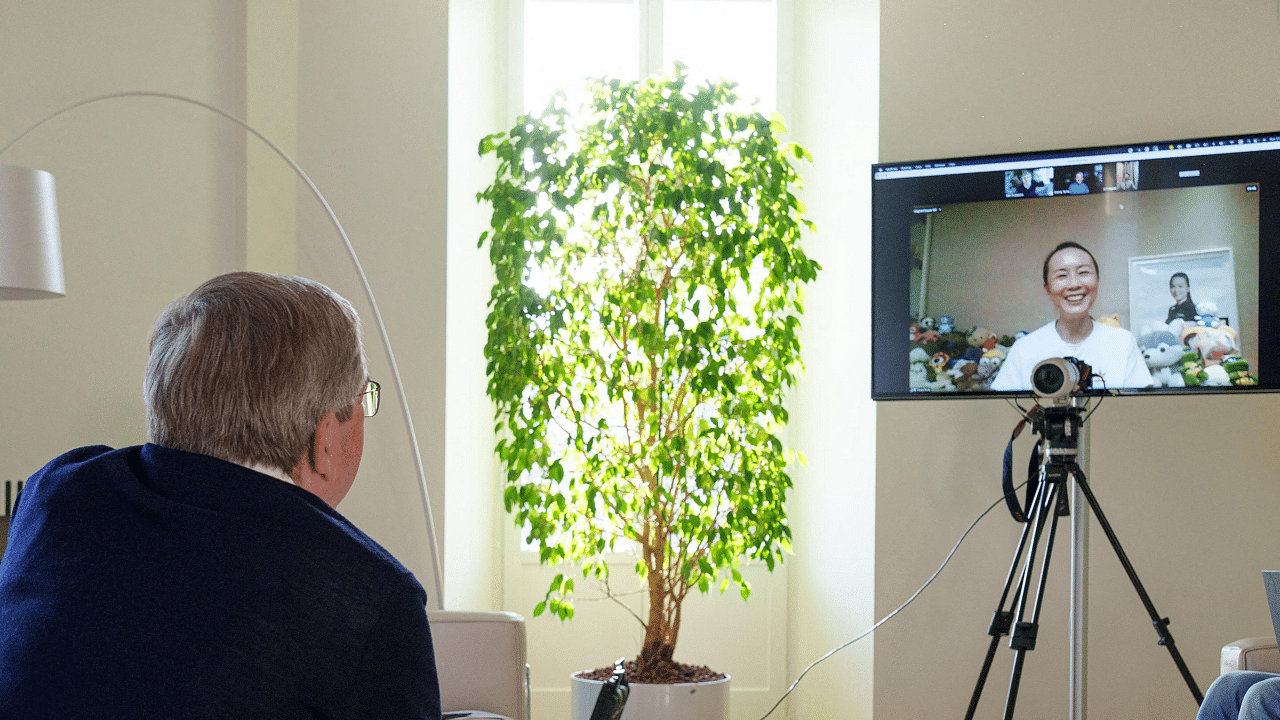 IOC President Thomas Bach holding a video call with Chinese tennis star Peng Shuai. Credit: AFP Photo