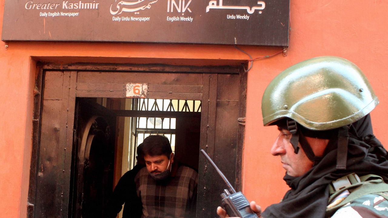A raid at the Greater Kashmir office on October 28, 2020. Credit: PTI Photo