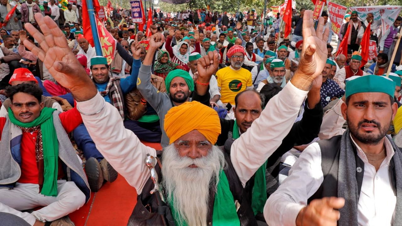Farmers shout slogans during a mass rally to demand minimum support prices be extended to all produce, in Lucknow. Credit: Reuters Photo