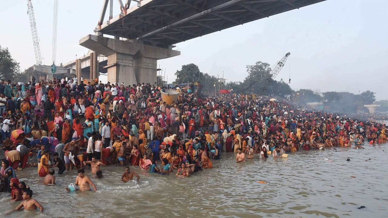 Devotees take bath in the Ganga River on the occasion of Kartik purnima in Patna. Credit: IANS Photo