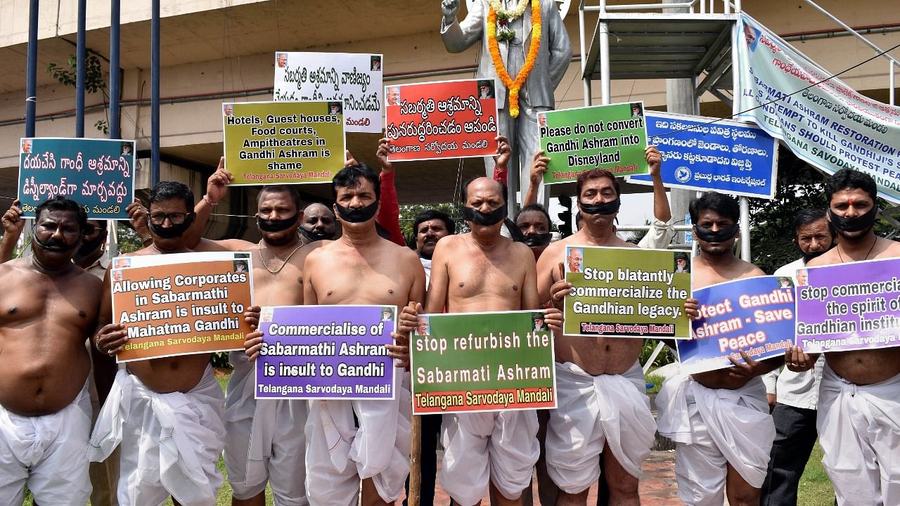 Followers of Mahatma Gandhi stage a protest against the reconstruction work of Sabarmati Ashram, in Hyderabad. Credit: PTI Photo