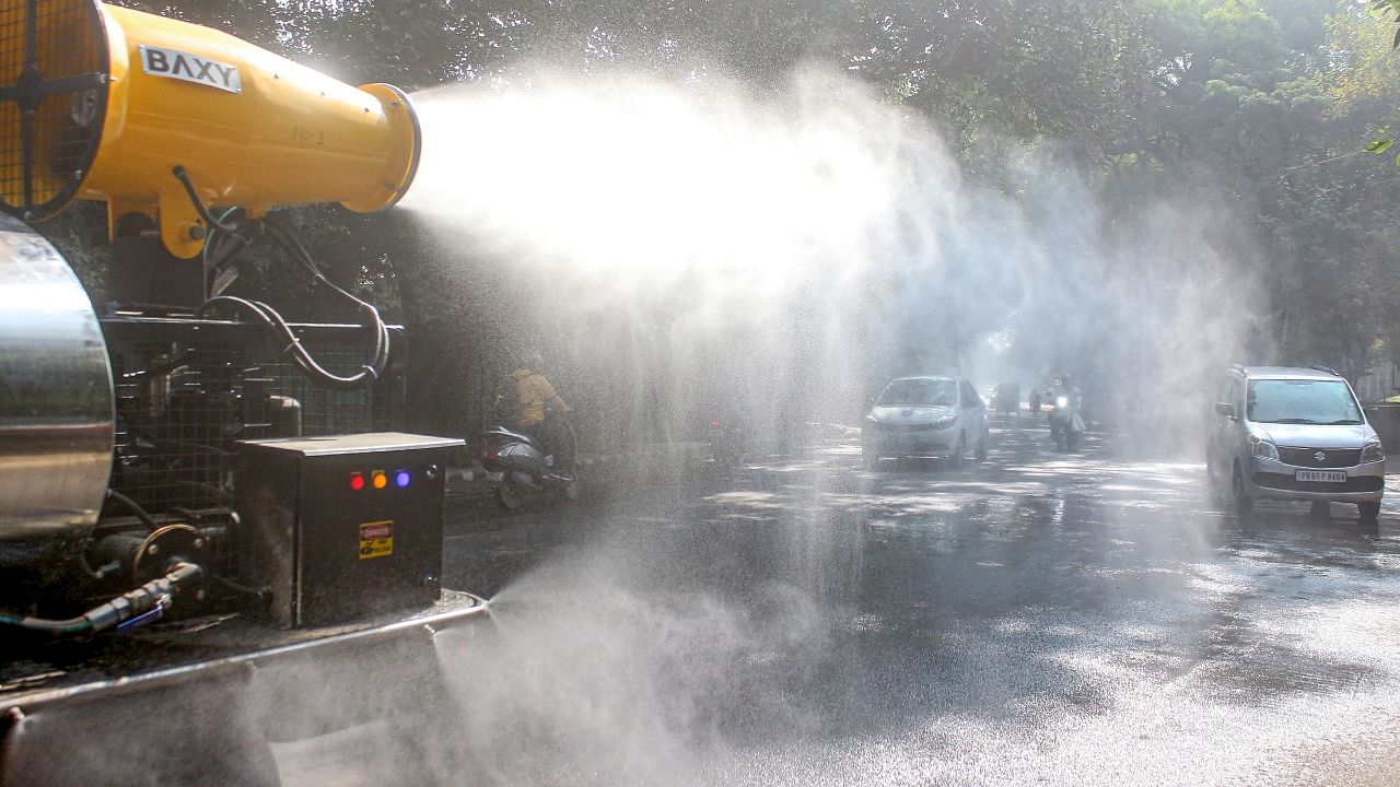  An anti-smog gun sprays water droplets to curb air pollution, at Civil Lines in Gurugram. Credit: PTI Photo