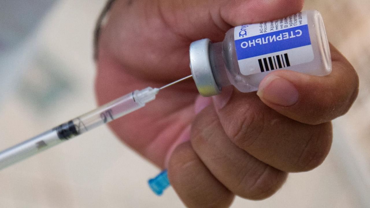 A healthcare worker prepares Sputnik Light Covid-19 vaccine. Credit: Reuters Photo
