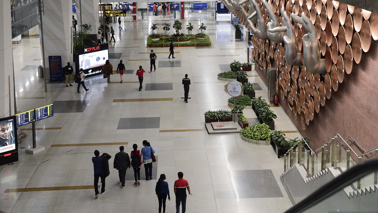Passengers at Terminal 3 of the Delhi airport. Credit: PTI Photo