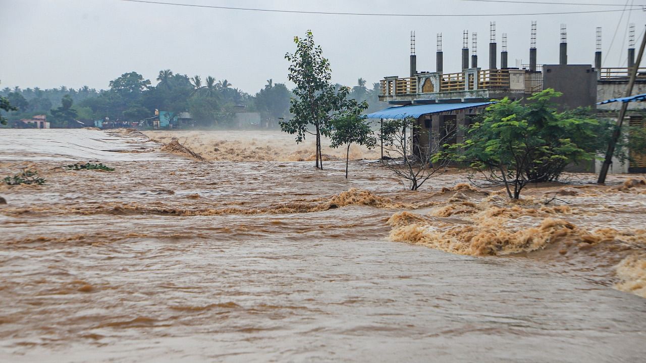 Swollen Palar river after the Kaveripakkam reservoir was opened due to incessant rain, in Vellore, Saturday, Nov. 20, 2021. Credit: PTI Photo