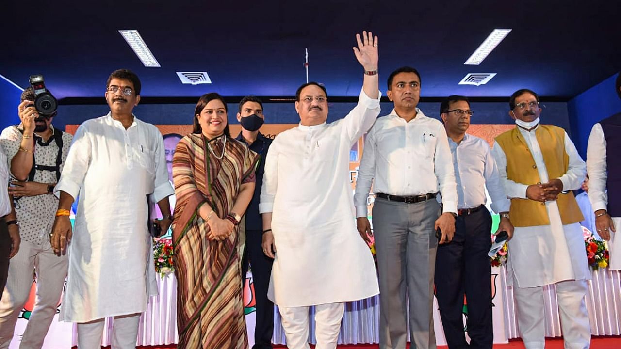 BJP National President J P Nadda waves towards party workers during 'Karyakarta Melava' at KTC Bus Stand Hall, Valpo. Credit: PTI Photo