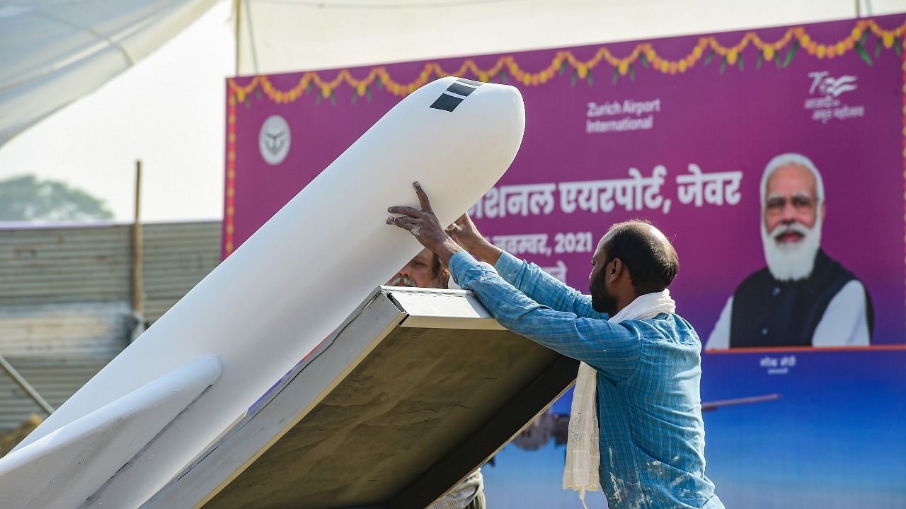 Preparations underway for the foundation stone laying ceremony of Jewar Airport by Prime Minister Narendra Modi. Credit: PTI Photo