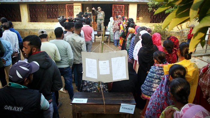 Voters wait to exercise their franchise in Tripura. Credit: PTI Photo